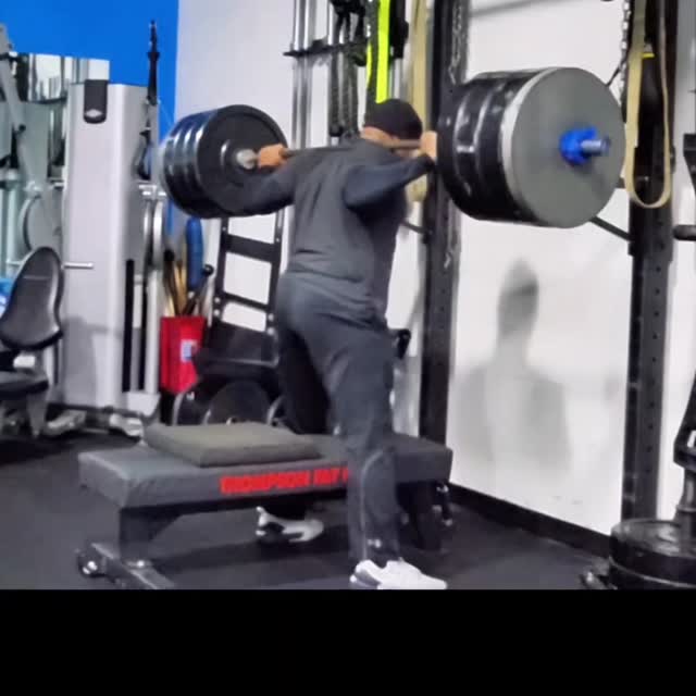 Barbell back squat in the M.Train power rack